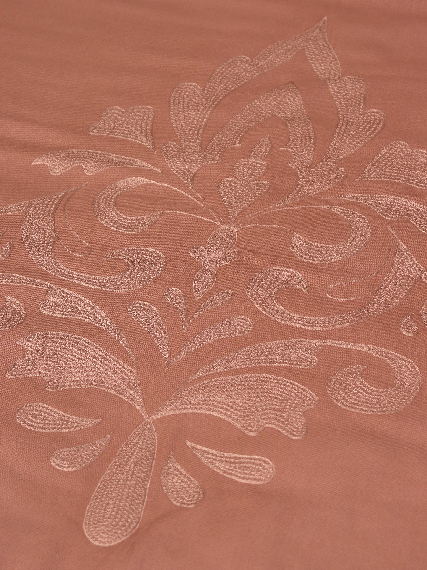 Coral colored embroidered bed quilt /comforter with 2 matching pillow covers made from cotton blended front and cotton backed quilt for king size double bed 