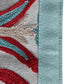 closeup of Hand embroidery with patchwork on edges of a 6 seater dining table runner - 12x84 inch