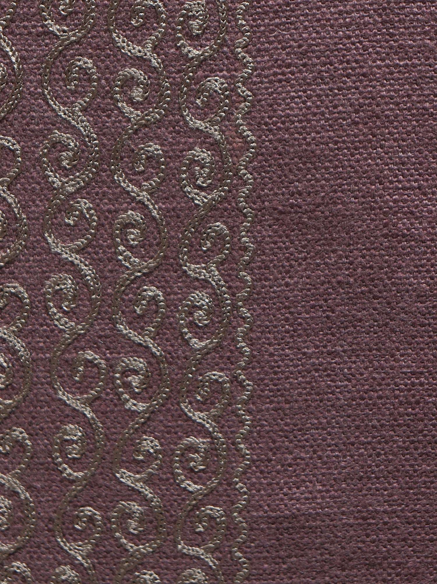 closeup of embroidery on violet table cover for 6 seater table