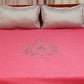 Pink colored embroidered bed cover with 2 matching pillow covers made from cotton blend for queen size double bed 90x108 inch