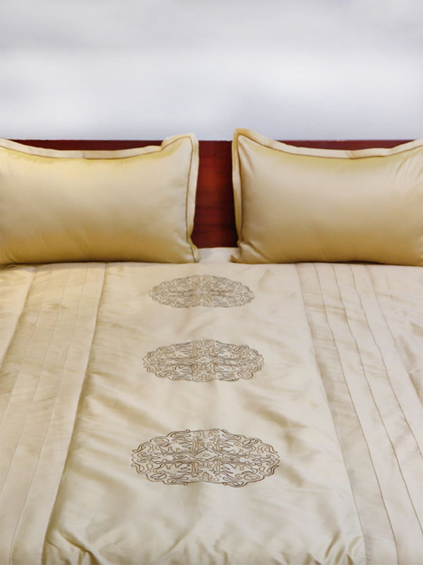 golden colored embroidered bed quilt with pintuck and 2 matching pillow covers made from polyester front and cotton backed quilt for king size double bed 