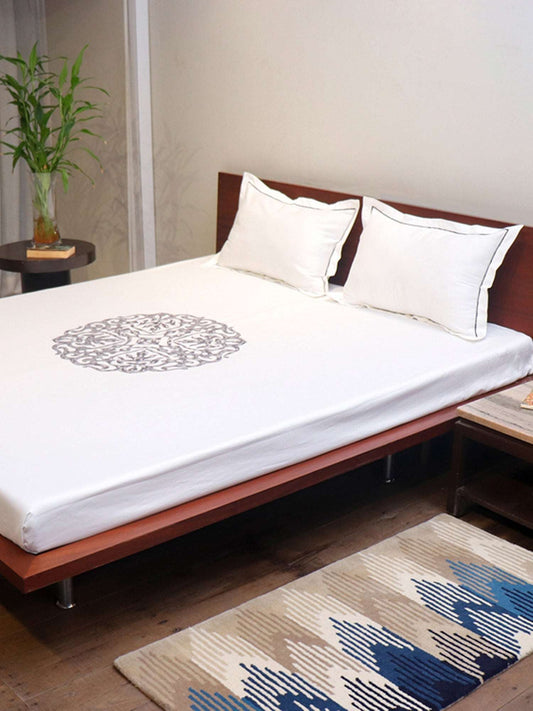 side view of white colored embroidered soft bedsheet with 2 matching pillow covers made from 100% pure cotton for king size double bed