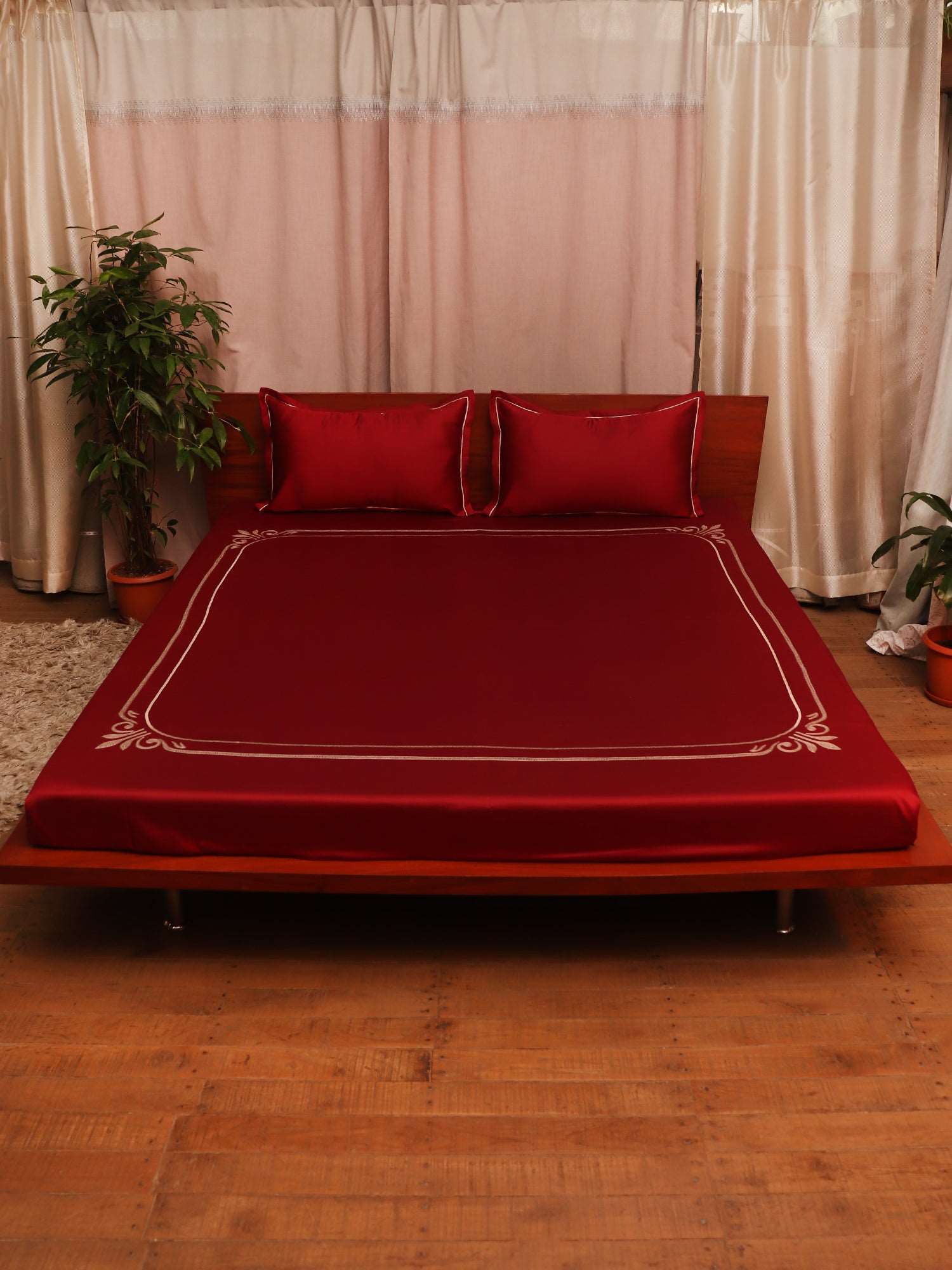 maroon colored embroidered soft premium bedsheet with 2 matching pillow covers made from 100% pure cotton for king size double bed in 300 thread count