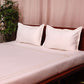 side view of white colored embroidered soft bedsheet with 2 matching pillow covers made from 100% pure cotton for king size double bed in 300 thread count fabric