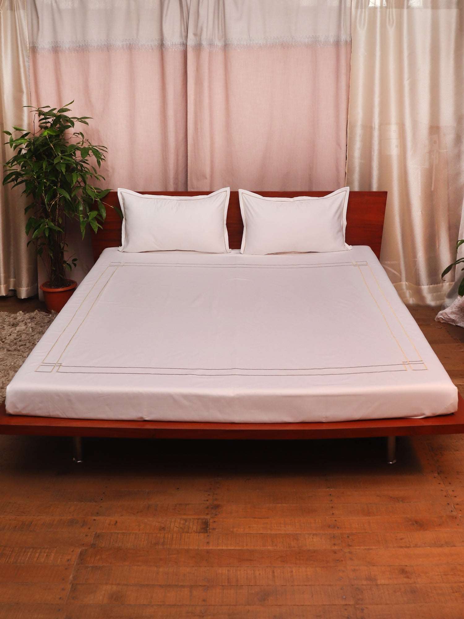 white colored embroidered soft bedsheet with 2 matching pillow covers made from 100% pure cotton for king size double bed in 300 thread count fabric