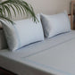 side view of light blue colored embroidered soft bedsheet with 2 matching pillow covers made from 100% pure cotton for king size double bed in 700 thread count fabric