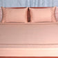 Blush pink colored embroidered soft bedsheet with 2 matching embroidered pillow covers made from 100% pure cotton for king size double bed in 700 thread count fabric