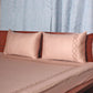 side view of Blush pink colored embroidered soft bedsheet with 2 matching embroidered pillow covers made from 100% pure cotton for king size double bed in 700 thread count fabric
