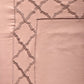 close up of Blush pink colored embroidered soft bedsheet with 2 matching embroidered pillow covers made from 100% pure cotton for king size double bed in 700 thread count fabric