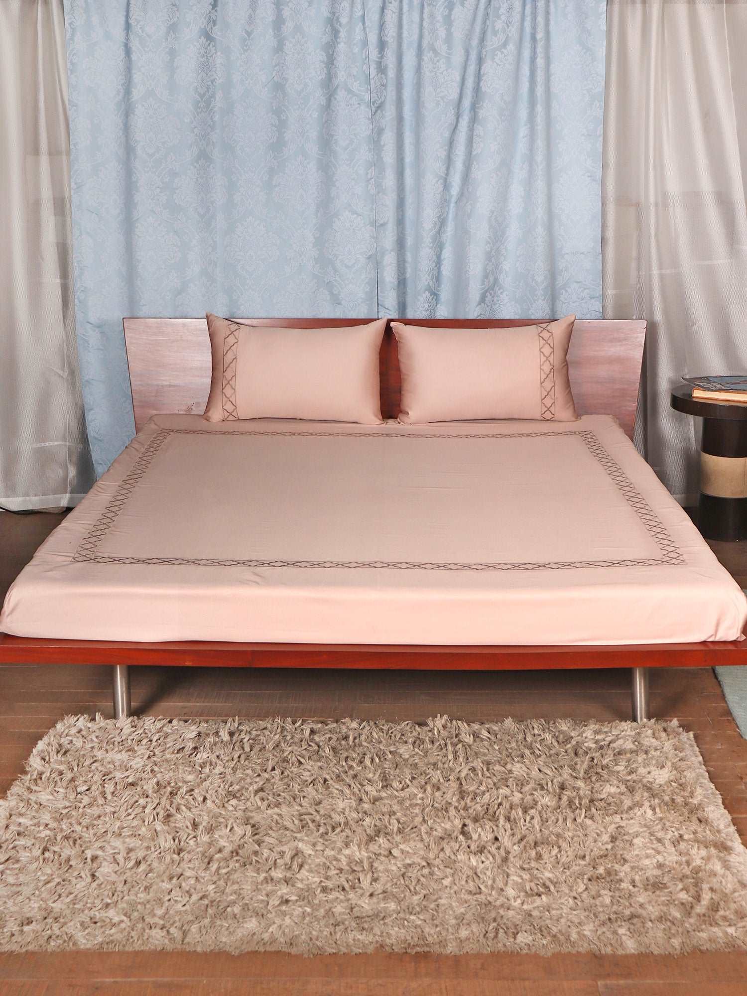 Blush pink colored embroidered soft bedsheet with 2 matching embroidered pillow covers made from 100% pure cotton for king size double bed in 700 thread count fabric