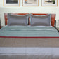 Grey colored bed quilt with 2 matching pillow covers made from polyester front and cotton backed quilt for king size double bed 