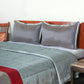 Grey colored bed quilt with 2 matching pillow covers made from polyester front and cotton backed quilt for king size double bed 