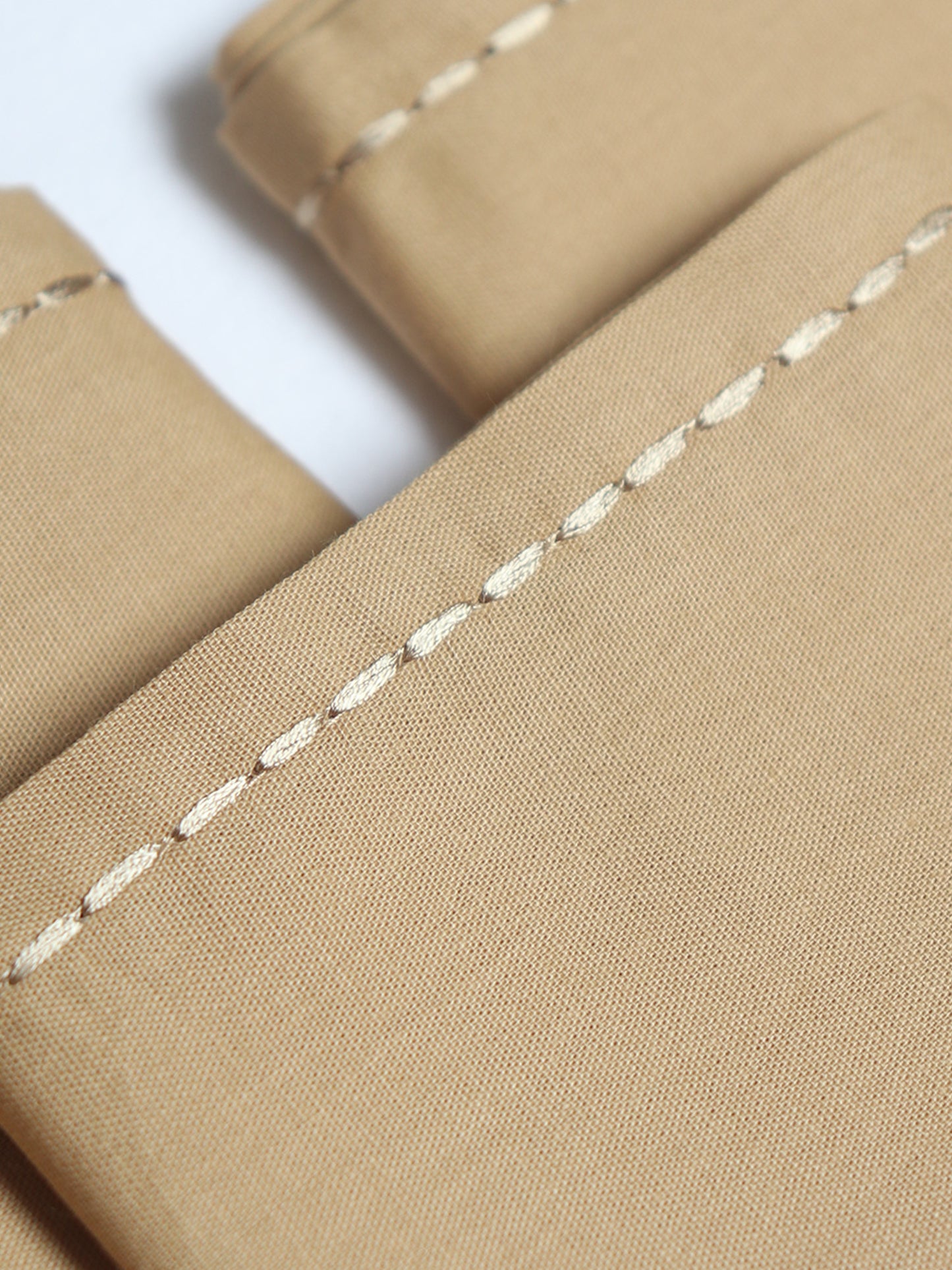 closeup of chawal taka hand embroidered set of 6 dinner napkins in beige color - 16x16 inch