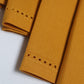 closeup of fagotting embroidered set of 6 dinner napkins in mustard color - 16x16 inch