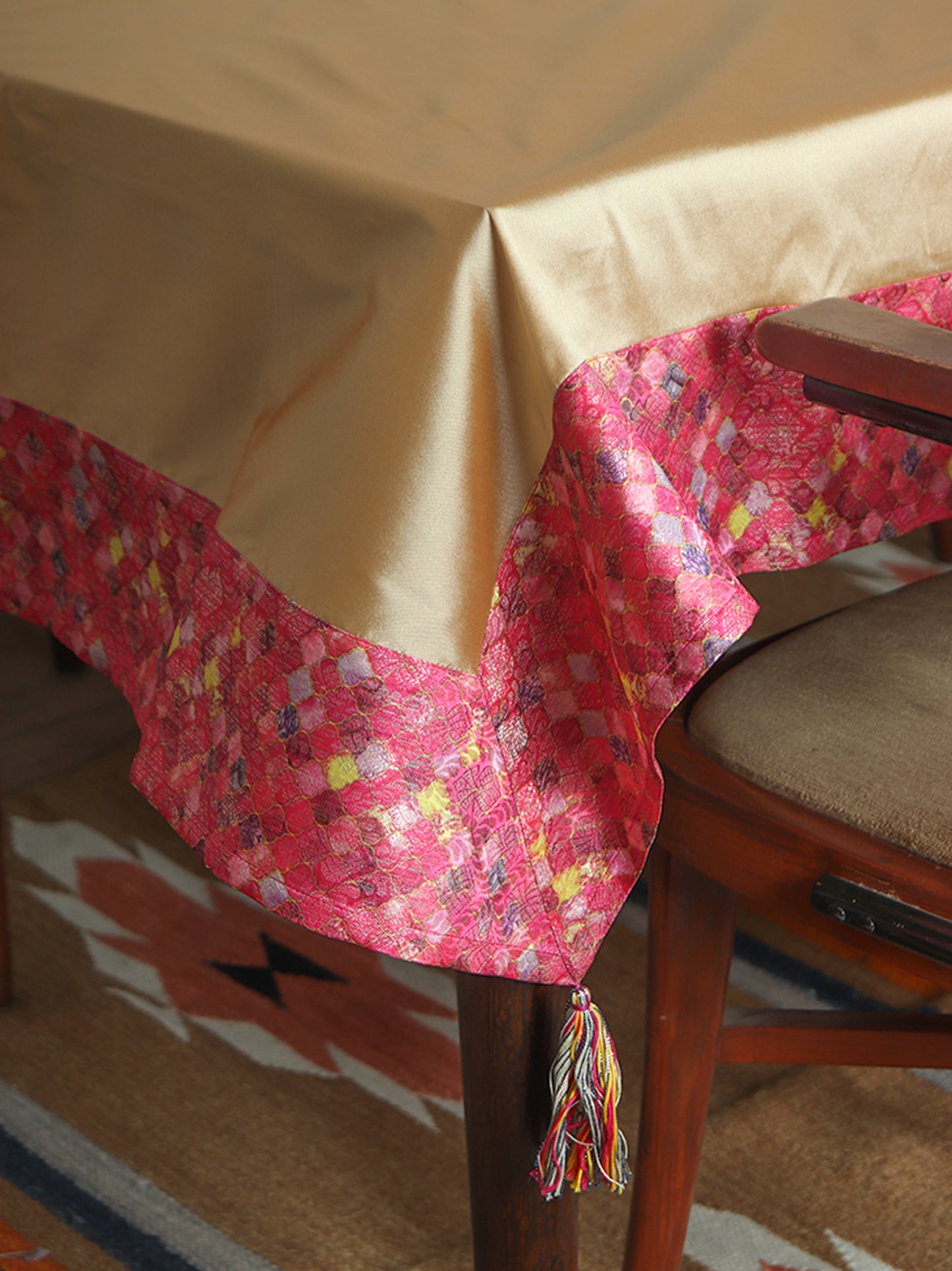 pink colored benarasi brocade silk and golden table cover with panel border and multi colored tassels for 6 seater table 52x84 inches