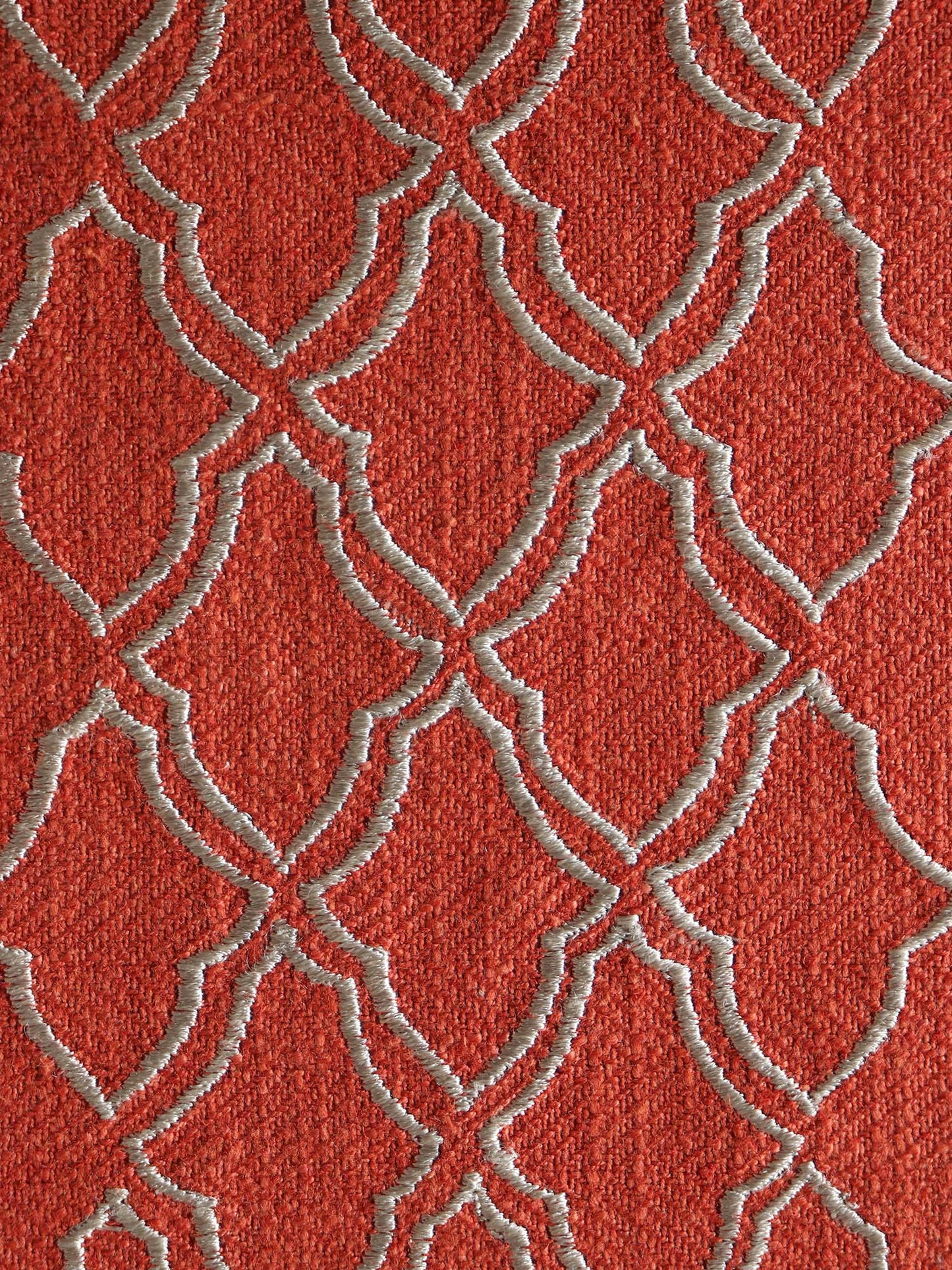 closeup of embroidered dinner table placemats in rust and beige contrast colors - 13x19 inch 