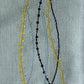 closeup of embroidered dinner placemats in grey color - 13x19 inch