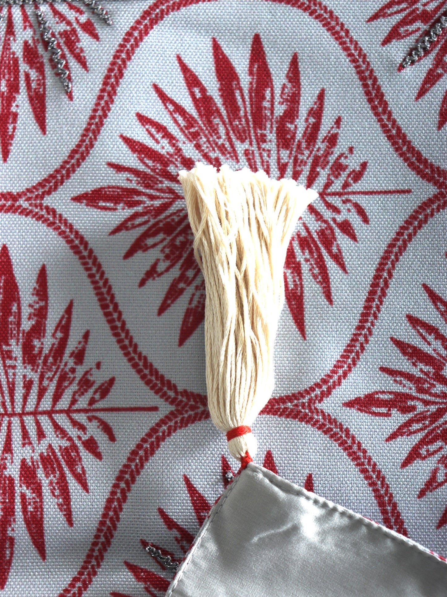 closeup of tassels on hand embroidered table runner