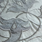 closeup of floral embroidery with hand crafted applique design on gray table runner - 12x84 inch