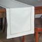 off white colored embroidered table runner golden embroidery on border for 6 seater table - 52x84 inches.
