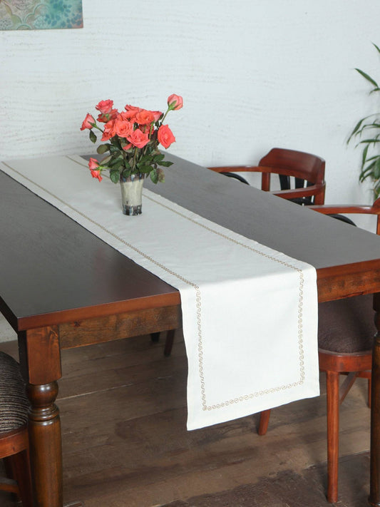 off white colored embroidered table runner golden embroidery on border for 6 seater table - 52x84 inches.