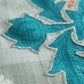 closeup of hand embroidered table runner for 6 seater dining table