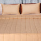 Golden colored embroidered bed quilt /comforter with 2 matching pillow covers made from polyester front and cotton backed quilt for king size double bed 