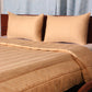 Golden colored embroidered bed quilt /comforter with 2 matching pillow covers made from polyester front and cotton backed quilt for king size double bed 