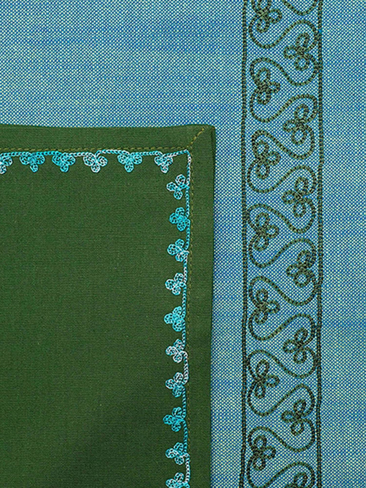 closeup of embroidered dinner table mats and napkins in contrast colors - 13x19 inch