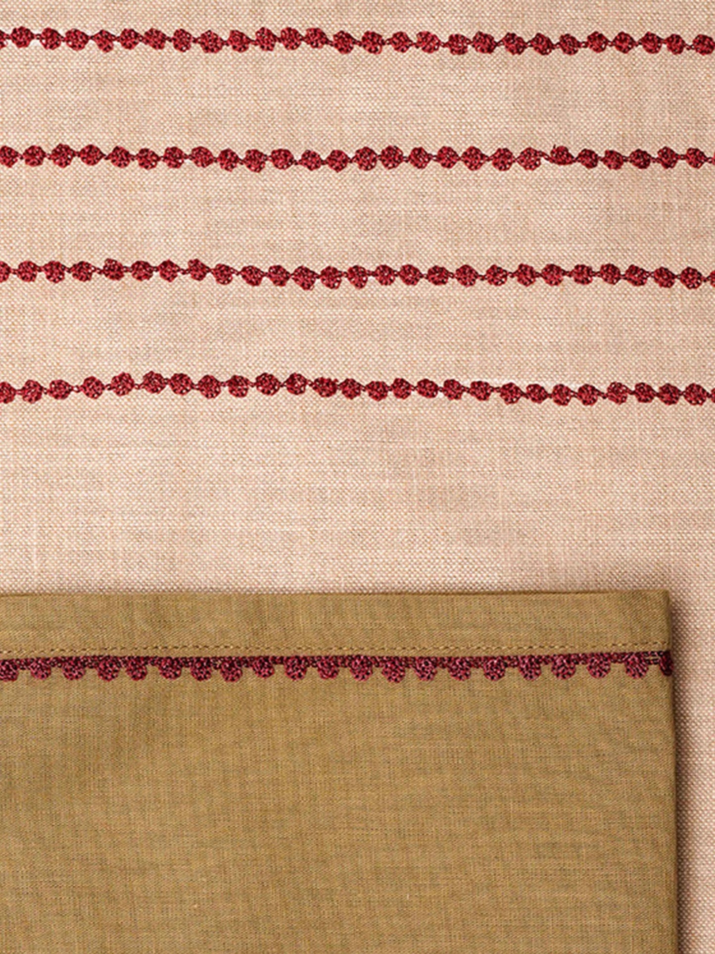 closeup of beige tablemats having red embroidered with flange border and set of cotton napkins beige - 13x19 inch
