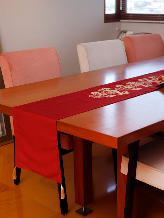 red colored embroidered table runner with tassels on corners for 6 seater table - 52x84 inches.