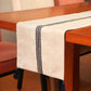 grey colored embroidered table runner with tassels on corners for 6 seater table - 52x84 inches.